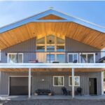 Modern galvanized steel barndominiums in Alhambra, Arizona, blending rustic charm with contemporary design