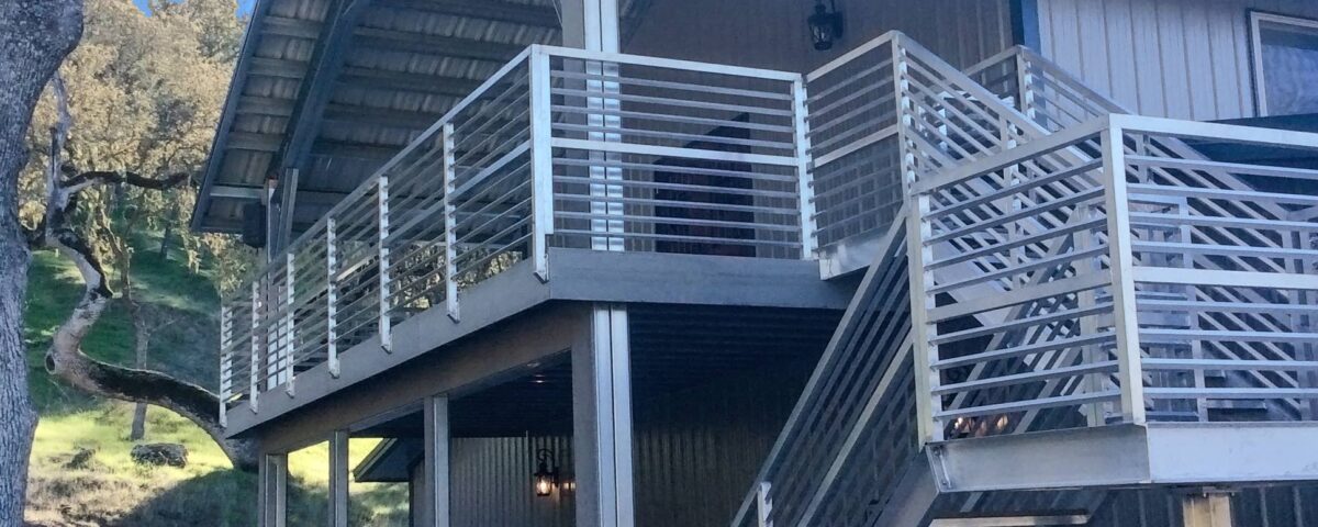 Exterior view of galvanized steel barndominiums in Saddle Brooke, Arizona, highlighting modern design and rural charm