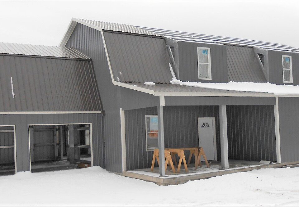 Exterior view of galvanized steel barndominiums in Thatcher, Arizona showcasing modern design and rural charm