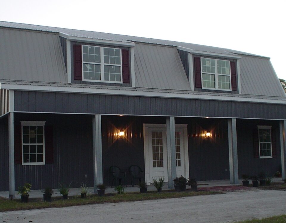 Exterior view of galvanized steel barndominiums in Verde Village, Arizona, showcasing modern design and rural charm