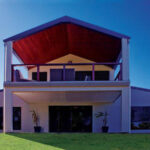 Exterior view of galvanized steel barndominiums in Winslow, Arizona showcasing modern architecture in a rural setting